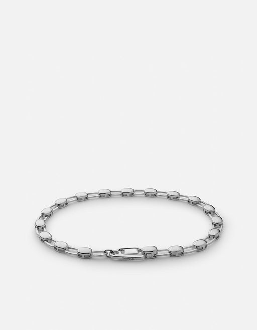 Miansai Ward chain bracelet in polished sterling silver with alternating disc and oval links laid flat to show the clasp