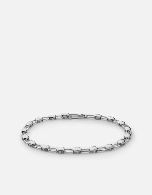 Miansai Ward chain bracelet in polished sterling silver with alternating flat disc and oval links arranged in an oval
