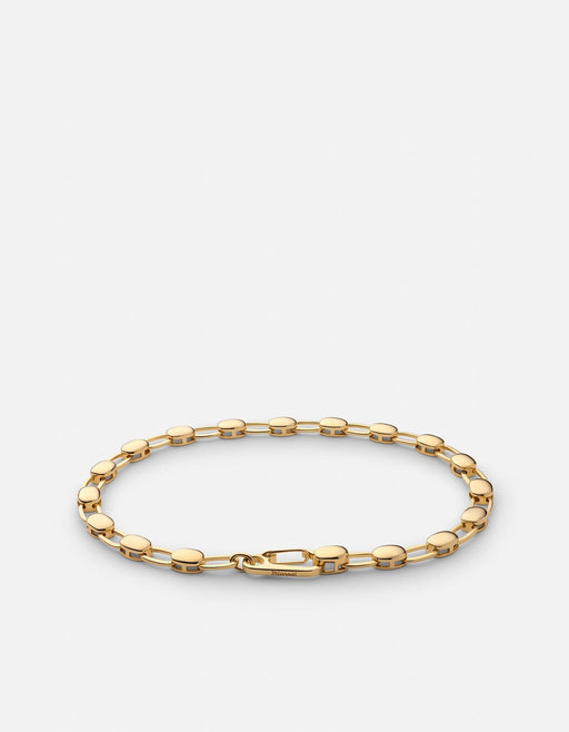 Miansai Ward chain bracelet in polished gold vermeil with alternating flat disc and oval links arranged in an oval to show the clasp
