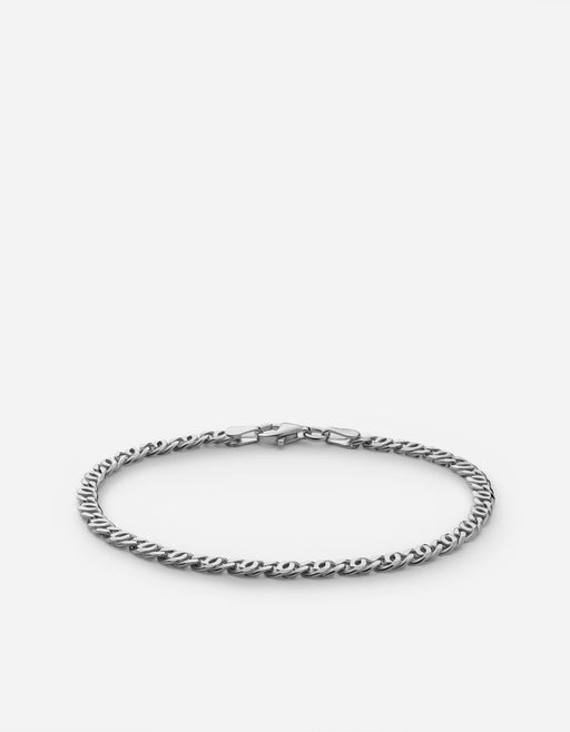 Miansai Track chain bracelet in polished sterling silver with interwoven twisted oval links and a clasp visible laid flat