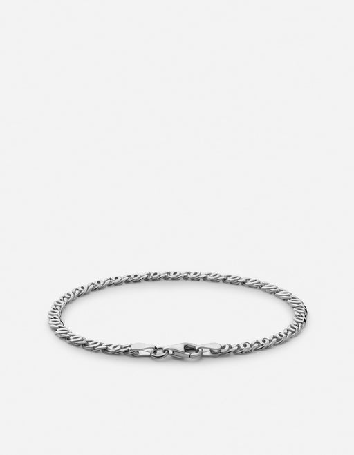 Miansai Track chain bracelet in polished sterling silver with interwoven twisted oval links laid flat with clasp visible