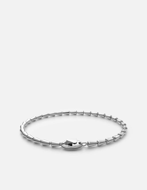 Miansai Elara chain bracelet in polished sterling silver with alternating tapered bead links and a custom clasp laid flat