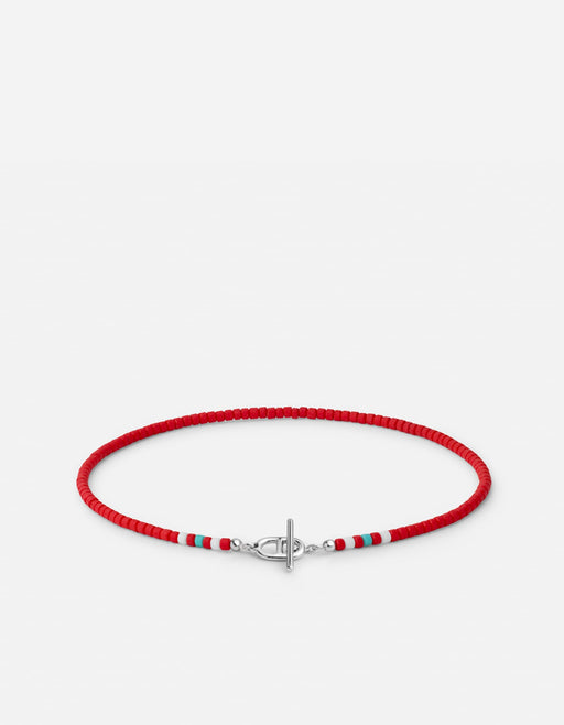 Miansai Avi bead bracelet in sterling silver with bright red beads and white and turquoise accents flanking a toggle closure laid flat