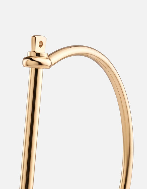 Miansai thin screw cuff bracelet in polished gold tone, close-up of the threaded bar closure