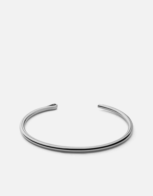 Miansai Niam cuff in polished sterling silver with asymmetrical rounded and squared ends, shown open on a white background