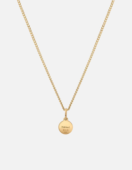 Miansai Ojos pendant necklace in gold vermeil with a round engraved medallion suspended from a delicate chain on a light background