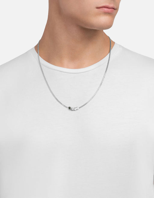 Miansai Opus necklace in sterling silver worn at the neck with a green chalcedony stone set inline on a curb chain