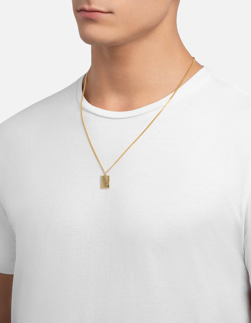 Miansai Luma pendant necklace in gold vermeil worn at the neck with a sunray engraved rectangular tag and green agate accent