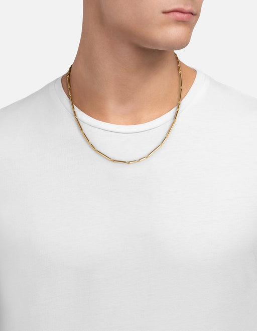 Miansai Shine chain necklace in gold vermeil with elongated bar links, worn at the neck over a white shirt