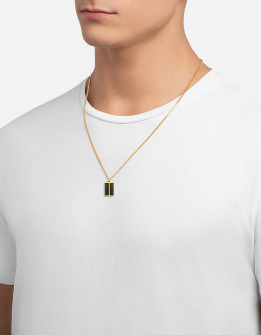 Miansai Duo Jasper pendant necklace in gold vermeil with a split rectangular green jasper pendant worn at the neck over a white shirt