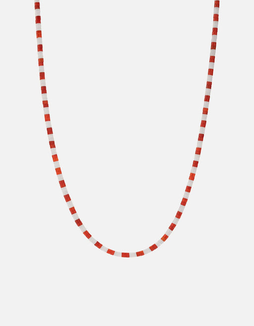 Miansai Kai carnelian bead necklace with alternating red-orange and white beads arranged in a gentle U-shaped drape