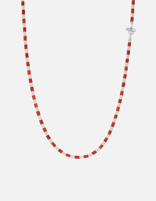 Miansai Kai carnelian bead necklace in alternating red orange and white beads with a sterling silver T bar clasp in a U shaped drape