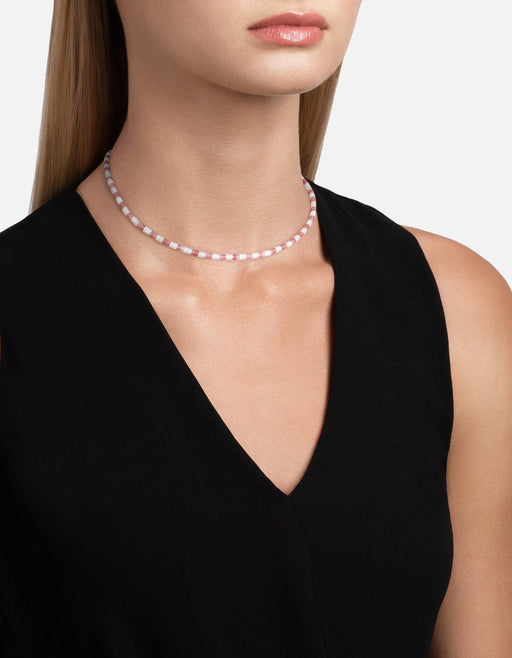 Miansai Kai bead choker with alternating blush pink and white rhodochrosite beads worn around the neck