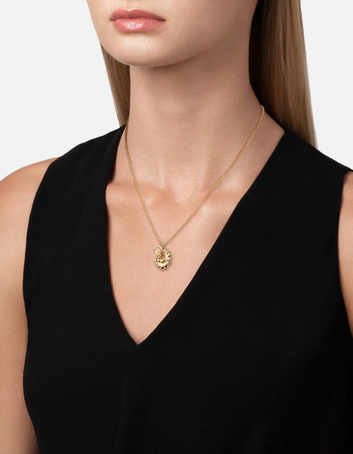 Miansai Claddagh Guardian pendant necklace in polished gold vermeil worn at the neck with a sun-framed Claddagh pendant over a black top