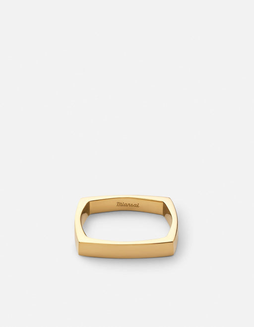 Miansai Level ring in gold vermeil with four softened flat sides and a low architectural profile shown laid flat