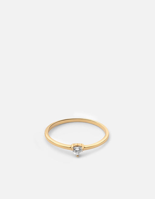 Miansai gold vermeil ring with a small heart-cut sapphire set low at the front of a smooth polished band