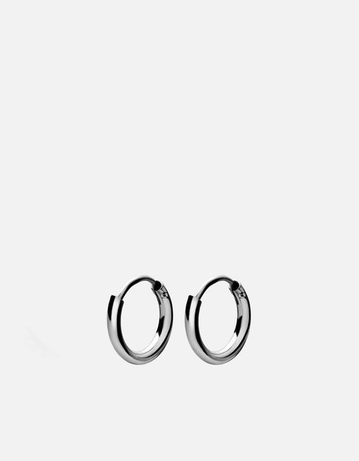 Miansai Aeri huggie earrings in polished sterling silver with slim rounded hoops shown as a matching pair