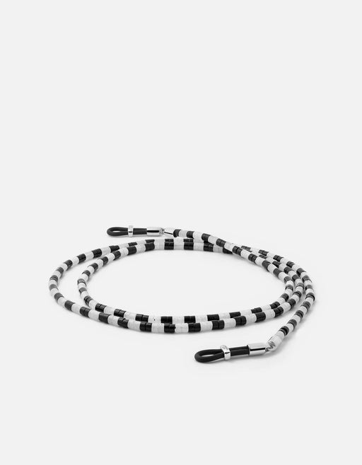 Miansai Kai Onyx sunglass safety cord in sterling silver with alternating black and white beads and black loop ends laid flat