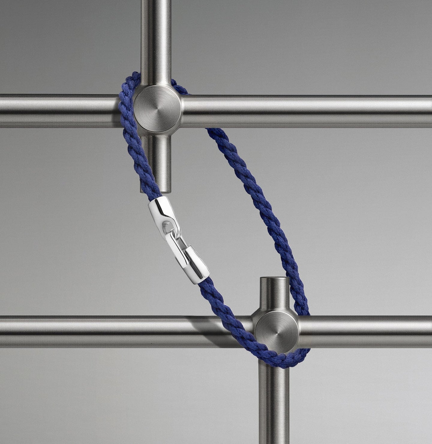 Cruz Rope Bracelet on blue rope.