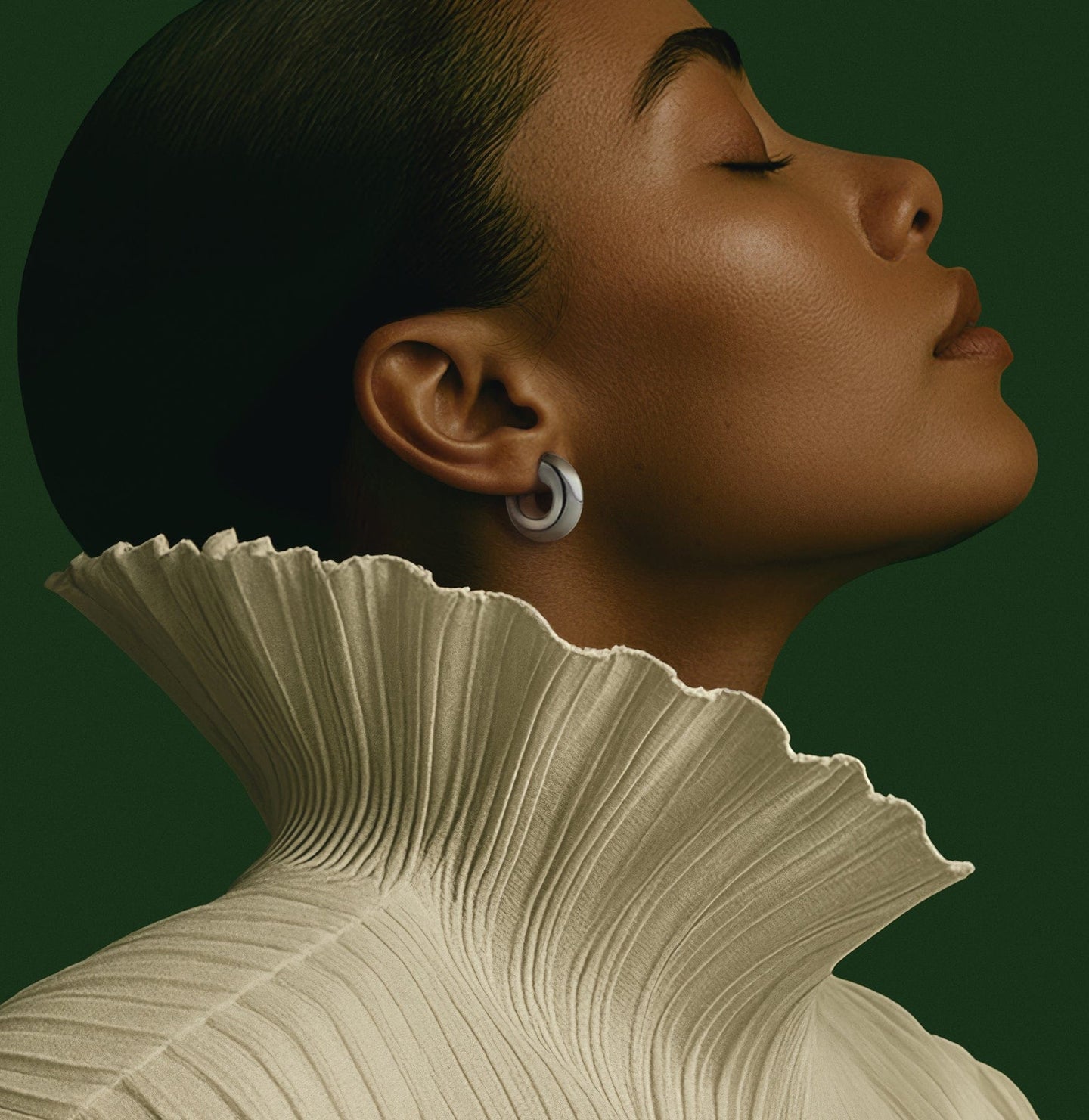Women's New - Close-up of a woman's profile with a textured collar against a green background