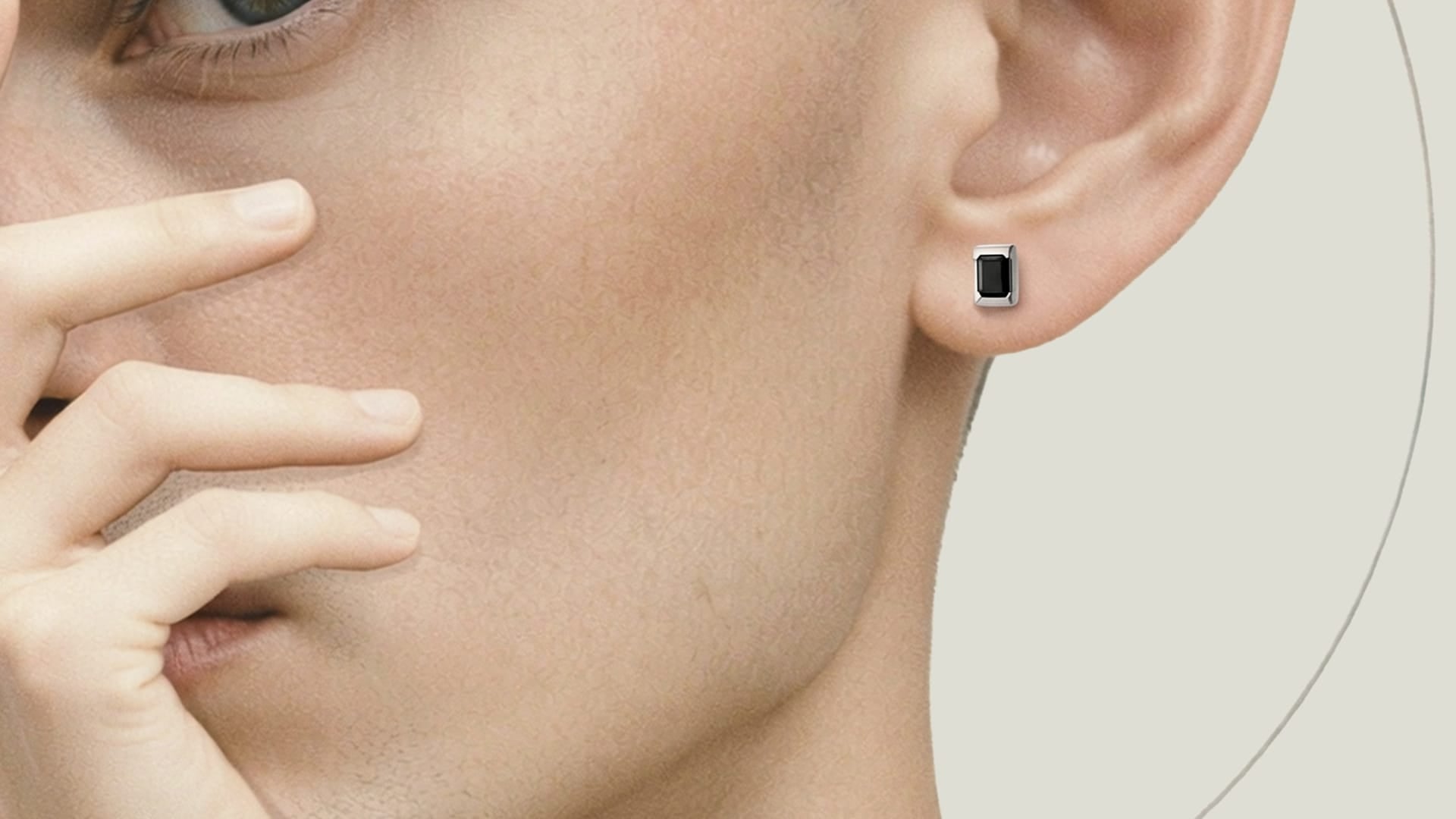 Man wears earrings