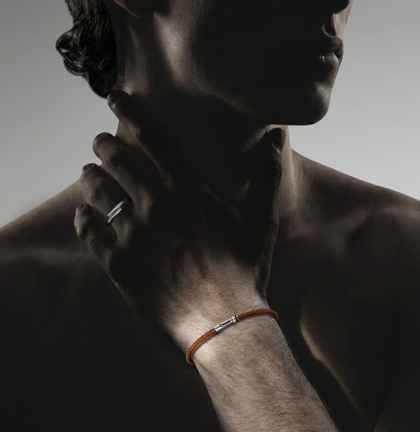 Man wearing bracelet and ring.