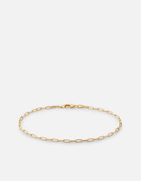 Miansai 2.5mm Volt Link cable chain bracelet in polished 14k yellow gold laid flat with elongated open links and clasp closure