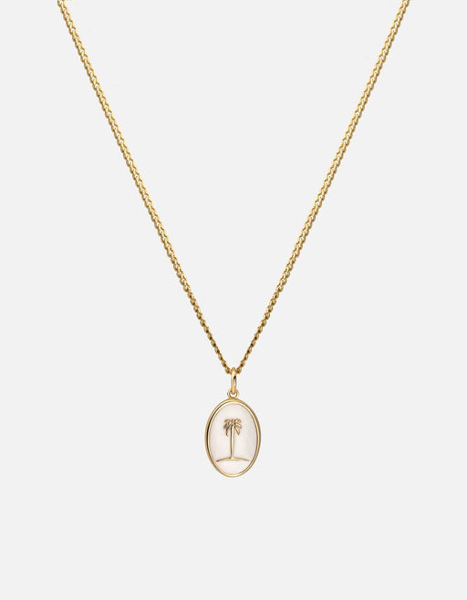 Miansai gold vermeil pendant necklace with a small off-white enamel palm tree inside an oval frame on a fine chain