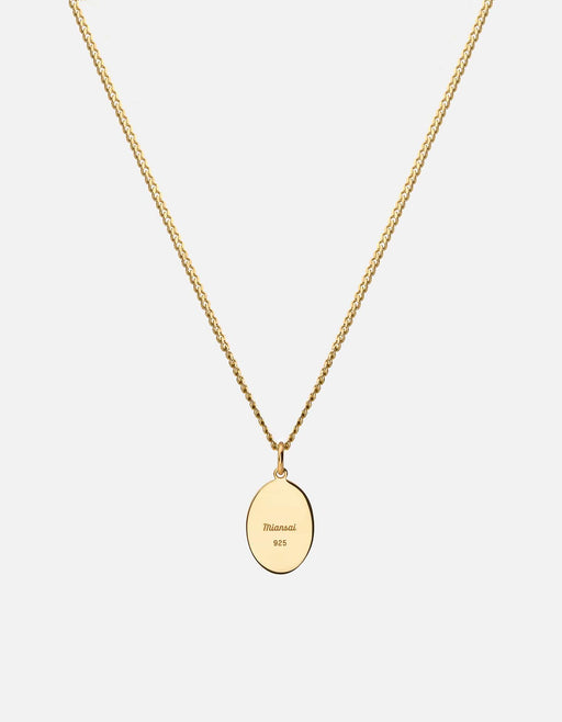 Miansai gold vermeil pendant necklace showing the engraved oval reverse marked Miansai 925 on a fine chain