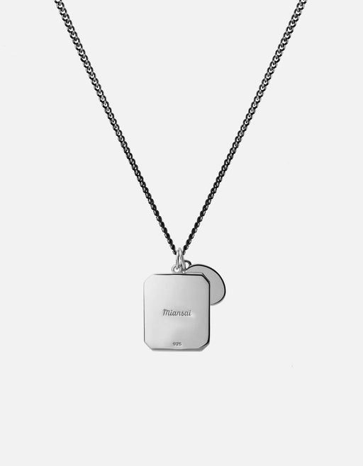 Miansai Hiawatha pendant necklace in sterling silver with a rounded rectangular pendant and circular accent on a chain