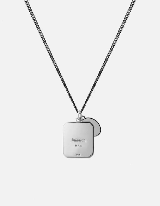 Miansai Hiawatha pendant necklace in sterling silver, shown from the reverse with overlapping engraved pendants on a fine chain