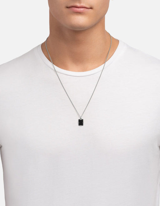 Miansai Lennox pendant necklace in sterling silver with a rectangular black onyx pendant worn at the neck over a white shirt