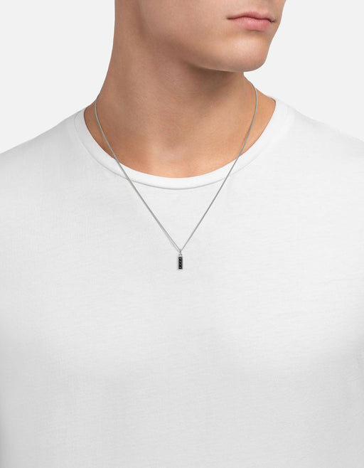 Miansai Totem Spinels pendant necklace in sterling silver worn at the neck with four vertically stacked dark spinel stones