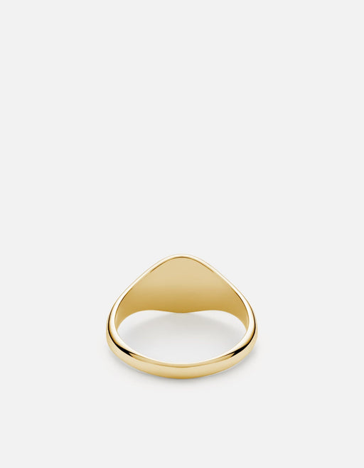 Miansai polished 14k gold signet ring with a smooth shield-shaped face shown at an angle on a light background