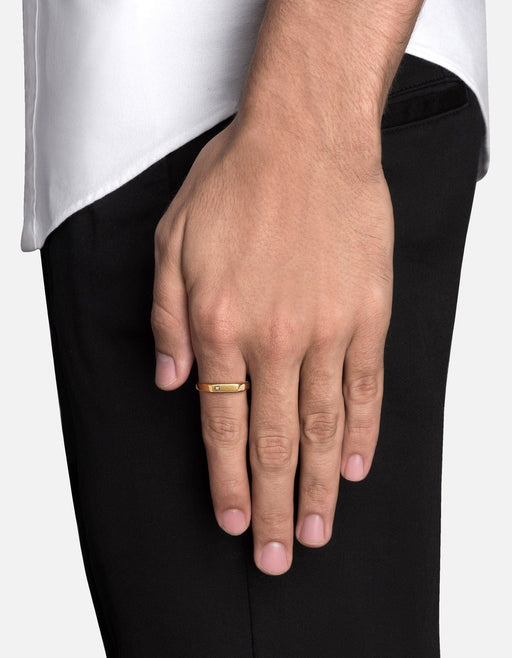 Miansai Thin Geo diamond signet ring in gold vermeil worn on a finger with a rectangular brushed face and flush-set diamond