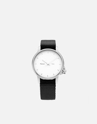 Miansai M24 watch with silver tone case white two hand dial and black nylon strap shown face up