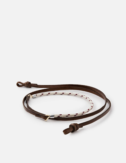 Miansai Nexus sunglass cord in brown leather with patterned nylon rope and sterling silver finishes laid flat