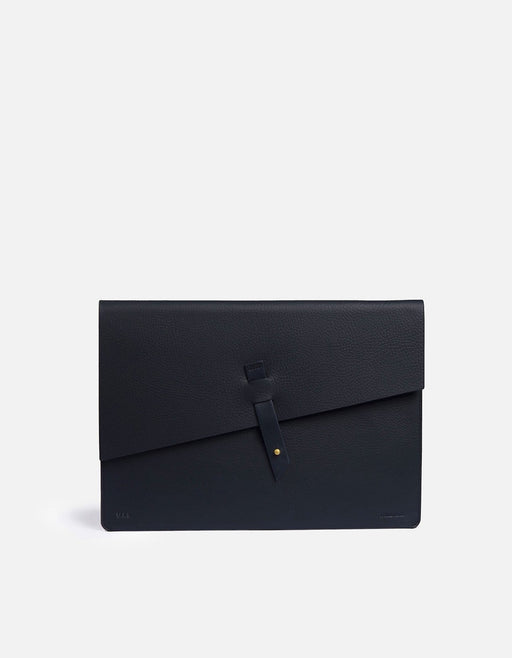 Miansai flat portfolio in textured navy Italian leather with a diagonal flap and single strap closure through a leather loop