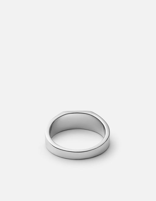 Miansai Geo signet ring in polished sterling silver with a broad smooth band shown from an angled view